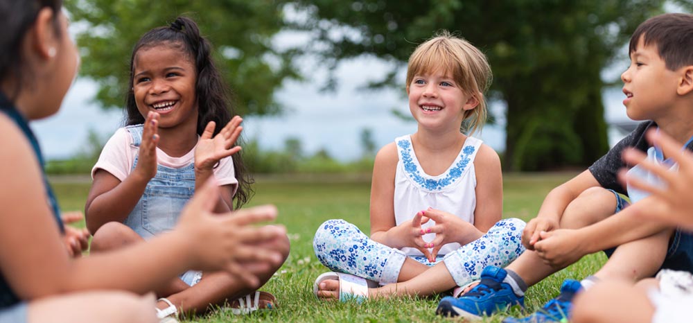 A group of children sitting in a circle