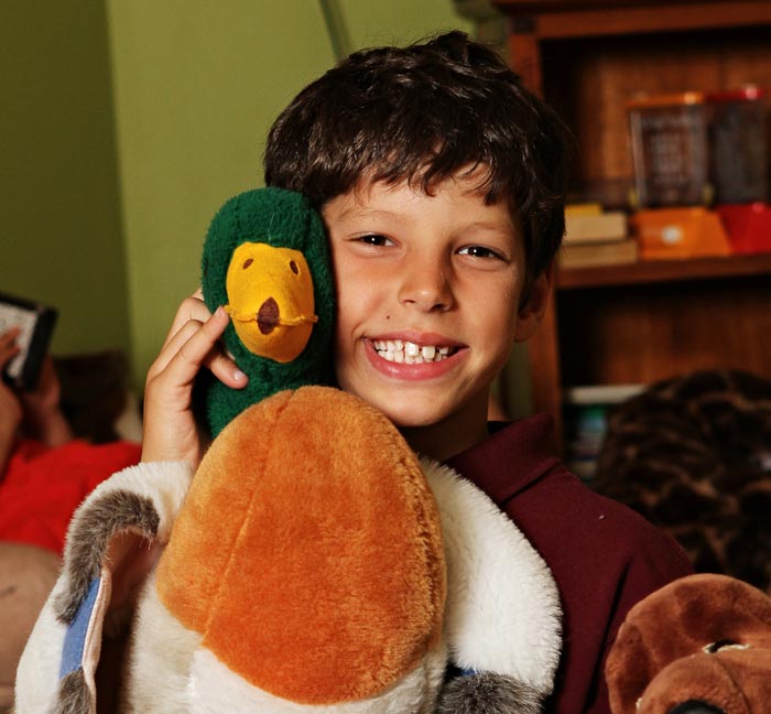 Young boy with a duck