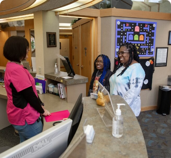 staff talking to patients